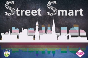 Promotional graphic for Street Smart shows a city silhouette with pride flag overlayed. The words Street Smart appear above.