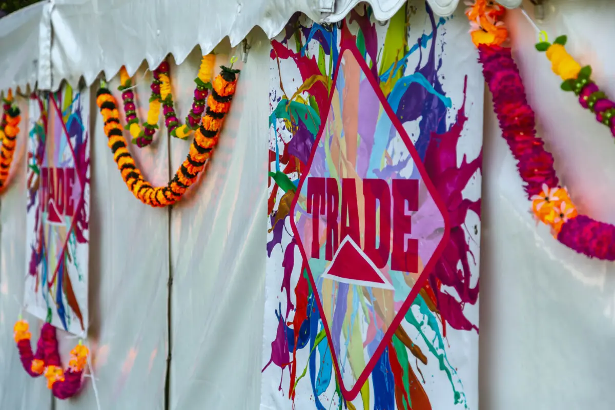 Colourful Trade logo displayed on roller banner at an event