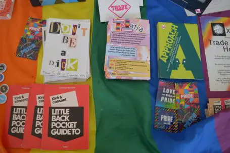 Promotional health information leaflets spread out on a table.