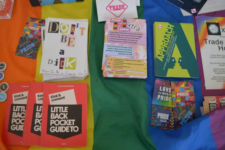 Promotional health information leaflets spread out on a table.